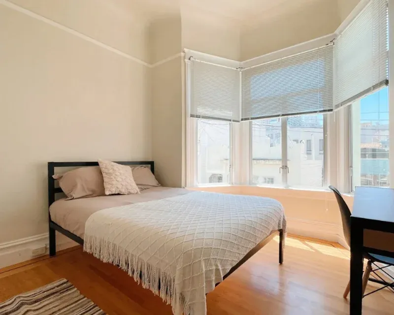 Sunny bedroom with bay window