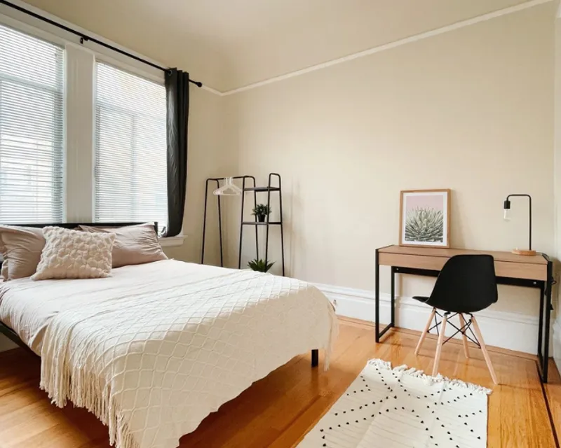 Furnished bedroom with desk